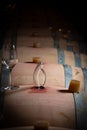 FRANCE, GIRONDE, SAINT-EMILION, SAMPLING A GLASS OF WINE IN A BARREL WITH A PIPETTE FOR TASTING AND VINIFICATION Royalty Free Stock Photo