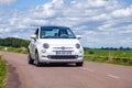 France Lyon 2019-06-20 closeup front view small compact white car hatchback Fiat 500 on the background of nature, beautiful Royalty Free Stock Photo