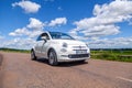 France Lyon 2019-06-20 closeup front view small compact white car hatchback Fiat 500 on the background of nature, beautiful