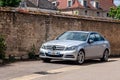 France Lyon 2019-06-20 closeup luxury silver German car sedan premium Mercedes C class with EU registration number parked near