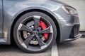 France Lyon 2019-06-20 closeup wheel premium sports car dark gray hatchback Audi RS 3, low profile tires, brand logo on cast disk