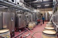 France Lyon 2019-06-20 Modern wine cellar, factory with large metallic clean shine steel fermentation tanks, pouring wine in