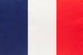 France national fabric flag, textile background. Symbol of international world european country Royalty Free Stock Photo