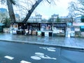 France Paris Bike path in front of Quai de Seine and bookseller Road wet by rain