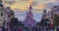 France, Paris, 20 June 2023: Pink fairytale castle in Disneyland. Disneyland amusement park complex in Paris. Crowd of