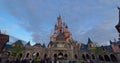 France, Paris, 20 June 2023: Pink fairytale castle in Disneyland. Disneyland amusement park complex in Paris. Crowd of