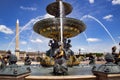 Maritime fountain located in the Place de la Concorde with Luxor Obelisk Royalty Free Stock Photo