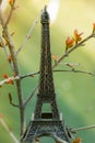 Toy Eiffel Tower in Paris. French journey in spring season. Romantic postcard.