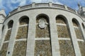 France, Paris, Rue Azais, stone wall with coat of arms of the Basilica of the Sacred Heart (Sacre-Coeur)