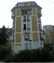 France, Paris, 1 Rue Marcel Sembat, 5-storey yellow house