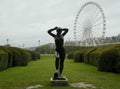 France, Paris, Tuileries Garden, bronze sculpture Baigneuse and Ferris wheel (Roue de Paris Royalty Free Stock Photo