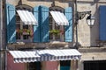 France provence style village cottage windows, blue shutters and flower Royalty Free Stock Photo