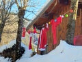 France Savoie Alps Maurienne Santa's clothes dry outside on a clothesline between two trees before being used for Christmas