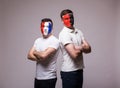 France vs Albania. Football fans of national teams before match on grey background. Royalty Free Stock Photo