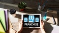 Franchise business model and growth concept on device screen. Royalty Free Stock Photo