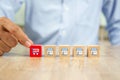 Franchise or franchising, Hand choose cube wooden toy block stack with shopping cart and franchises business store icon for growth Royalty Free Stock Photo