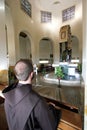 Franciscan monk prays at the Church of the Beatitudes, Galilee, Israel