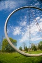 FRANCONIA SCULPTURE PARK, SHAFER, MINNESOTA half circle statue in a blue sky with clouds and green field