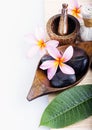 Frangipani flower with candle. Spa & aromatherapy concept. Royalty Free Stock Photo