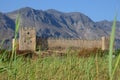 Frangokastello fort in Crete through the grass, mountains in the back Royalty Free Stock Photo