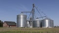Brock Corn or Grain bins on a farm. Elevators and grain legs direct corn supply to bins. Brock is part of Berkshire Hathaway