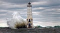 Frankfort Lighthouse, Crashing waves on Lake Michigan Royalty Free Stock Photo