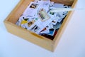 Frankfurt - August 2021: large set of mixed parts of envelopes and postage stamps from different countries, many objects in a box Royalty Free Stock Photo