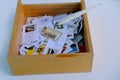 Frankfurt - August 2021: large set of mixed parts of envelopes and postage stamps from different countries, many objects in a box Royalty Free Stock Photo
