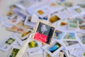 Frankfurt - August 2021: large set mixed parts envelopes, postage stamps from different countries, philatelist holding one object