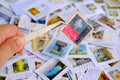 Frankfurt - August 2021: large set mixed parts envelopes, postage stamps from different countries, philatelist holding one object Royalty Free Stock Photo