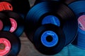 Frankfurt, Germany - April 2021: close-up of black vinyl record of Philips recording studio, color lighting, analog retro music