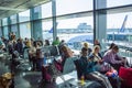 Frankfurt, Germany - April 28, 2018: passengers sitting and waiting for departure inside of Frankfurt Pearson Airport at Royalty Free Stock Photo