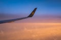 Frankfurt Germany 18.11.19 Condor Air airplane in the sky winglet in front of sunset or sunrise colorful sky clouds Royalty Free Stock Photo