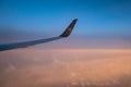 Frankfurt Germany 18.11.19 Condor Air airplane in the sky winglet in front of sunset or sunrise colorful sky clouds Royalty Free Stock Photo