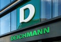 Deichmann logo on a facade. Deichmann is a major German shoe and sportswear retail chain Royalty Free Stock Photo