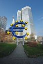 Euro Sculpture Euro-Skulptur at Willy-Brandt-Platz with Eurotower on background - Frankfurt, Germany
