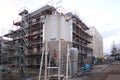 Frankfurt, Germany - January 2022: construction site, metal assembly scaffolding near walls of new multi-storey building,