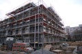 Frankfurt, Germany - January 2022: construction site, metal assembly scaffolding near walls of new multi-storey building,