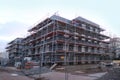 Frankfurt, Germany - January 2022: construction site, metal assembly scaffolding near walls of new multi-storey building,
