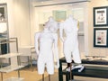 two naked female dummies in a window shop ready for preparation with clothes