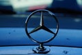 Silhouette of a Mercedes star on an older vehicle.