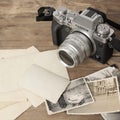 FRANKFURT, GERMANY - JUNE 2020: FUJIFILM XT4 camera with Fujinon lens, vintage photographs on old wood background, photographic