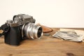 FRANKFURT, GERMANY - JUNE 2020: FUJIFILM XT4 camera with Fujinon lens, vintage photographs on old wood background, photographic