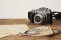 FRANKFURT, GERMANY - JUNE 2020: FUJIFILM XT4 with Fujinon lens, vintage photographs on old wood background, photographic concept,