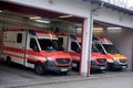 Frankfurt, Germany - June 2021: modern Red ambulance car is waiting for patient, medics provide assistance, concept of emergency