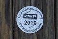 Seal of approval on a wooden mast in Frankfurt Royalty Free Stock Photo