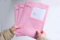 Frankfurt, Germany - March 2021: Male hands hold envelopes with a ballot paper for the Hessian local elections Frankfurt on March