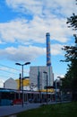 A metro station with a waste-to-energy plant in the background.