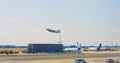 Frankfurt, Germany - May 2, 2023: plane takes off at Frankfurt city airport on runway. Beautiful view of riding cars at Royalty Free Stock Photo