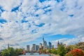 Skyline of the skyscrapers of Frankfurt under a big white blue sky with sheep clouds over a bridge over the Main River Royalty Free Stock Photo